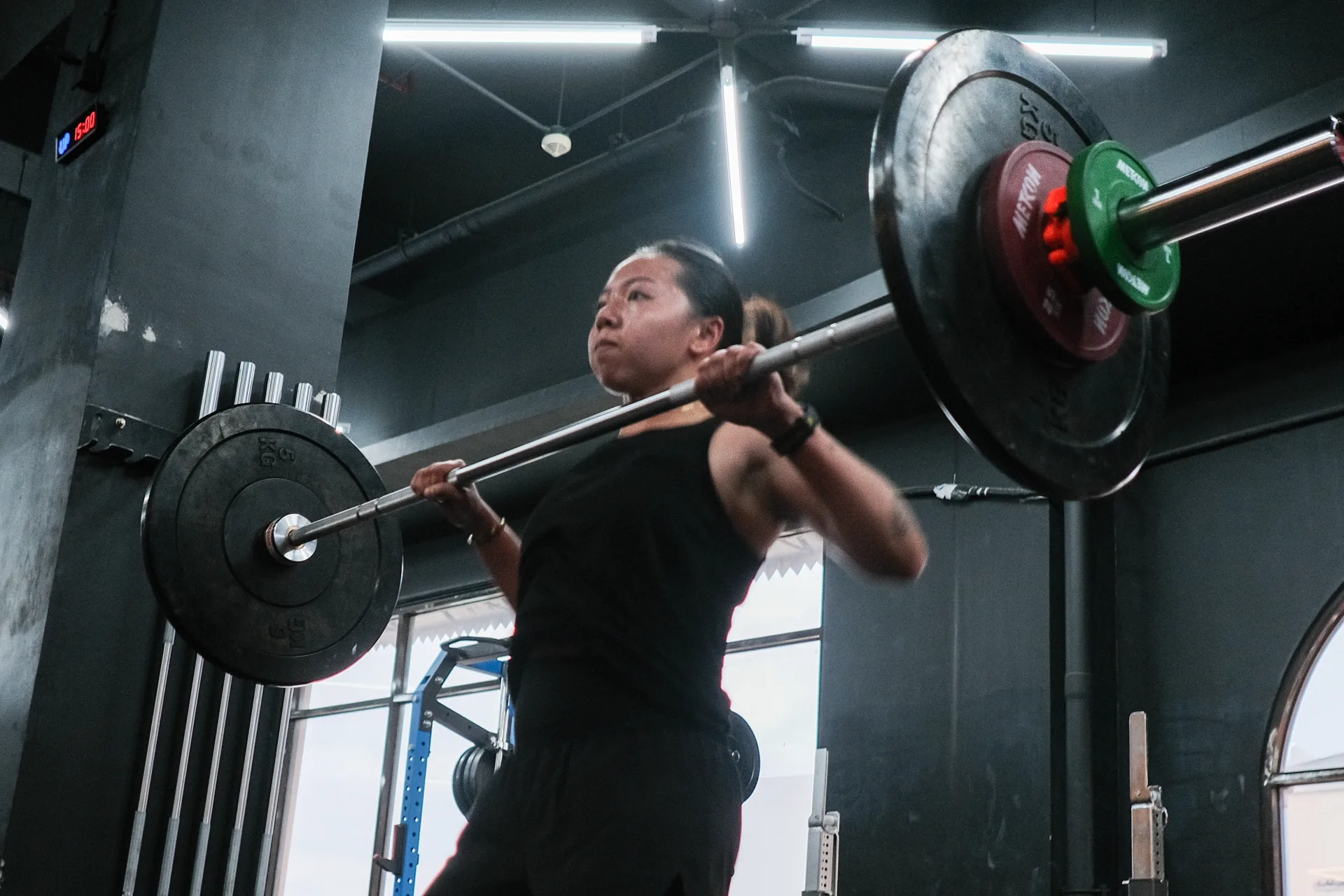 Barbell lifting on the platform at Gold's Gym Metcon