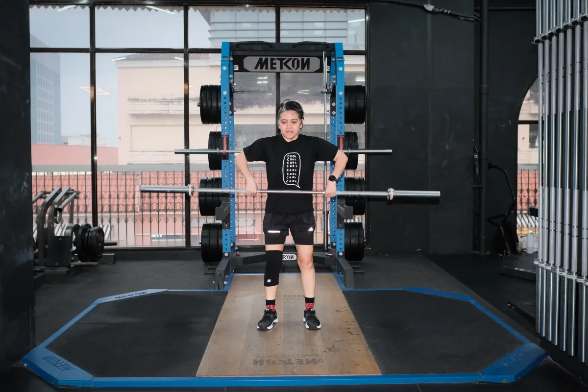 Barbell lifting on the platform at Gold's Gym Metcon